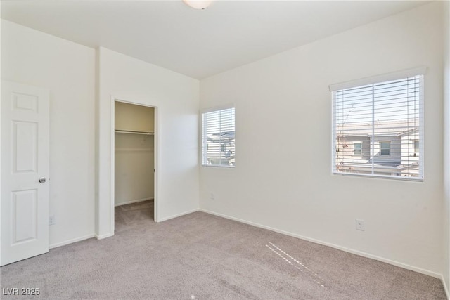 4566 Mansart Ct Unit 1104, North Las Vegas, NV 89031 - unfurnished bedroom with carpet floors, baseboards, a walk in closet, and a closet