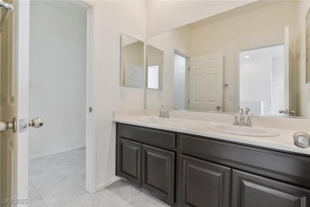 4566 Mansart Ct Unit 1104, North Las Vegas, NV 89031 - bathroom featuring double vanity, tile patterned flooring, and baseboards