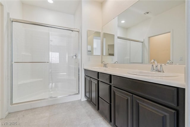 4566 Mansart Ct Unit 1104, North Las Vegas, NV 89031 - full bath featuring double vanity, a stall shower, tile patterned floors, and recessed lighting