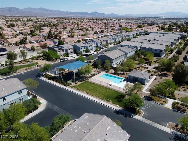 4566 Mansart Ct Unit 1104, North Las Vegas, NV 89031 - aerial view of residential area featuring a mountain backdrop and a pool area