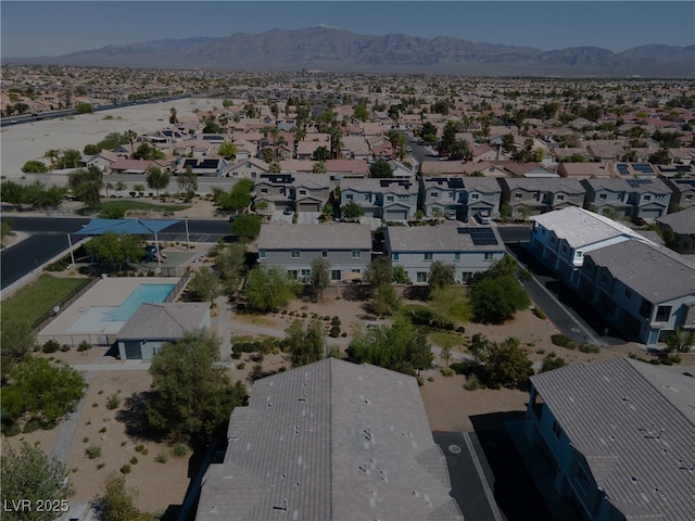 4566 Mansart Ct Unit 1104, North Las Vegas, NV 89031 - aerial perspective of suburban area featuring a mountainous background and a pool area
