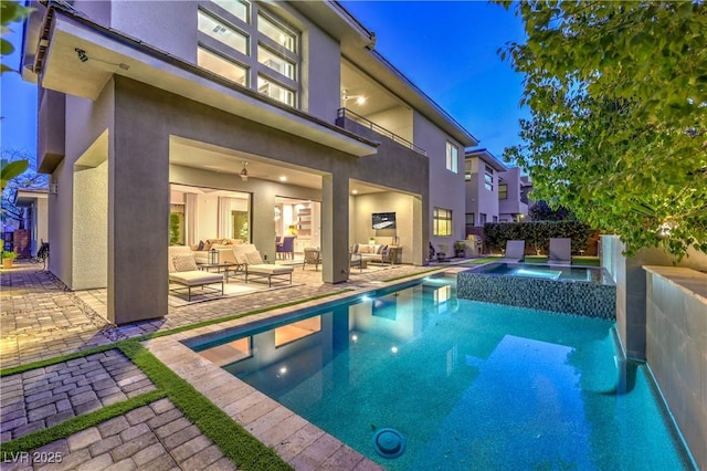 10 Sugarberry Ln, Las Vegas, NV 89135 - view of swimming pool with an outdoor living space, a patio area, and a pool with connected hot tub