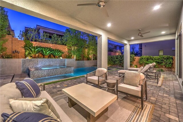 10 Sugarberry Ln, Las Vegas, NV 89135 - fenced backyard featuring a ceiling fan, an outdoor hangout area, and a patio area