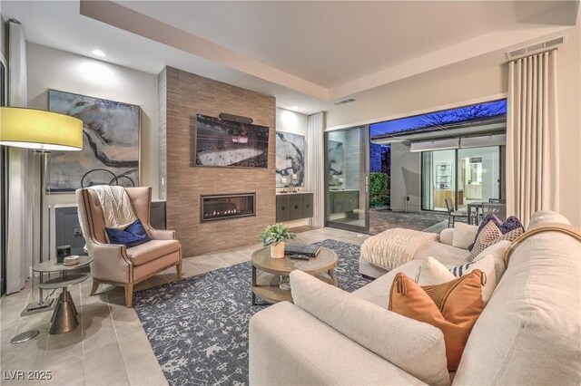 10 Sugarberry Ln, Las Vegas, NV 89135 - tiled living room with a tile fireplace and recessed lighting