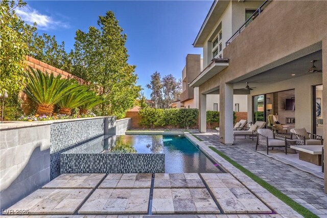10 Sugarberry Ln, Las Vegas, NV 89135 - view of pool featuring a patio, a fenced backyard, ceiling fan, and outdoor lounge area