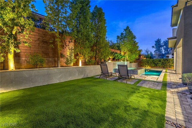 10 Sugarberry Ln, Las Vegas, NV 89135 - view of yard featuring a patio and an in-ground hot tub