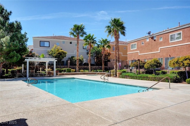 9303 Gilcrease Ave Unit 2217, Las Vegas, NV 89149 - community pool with a pergola and a patio area