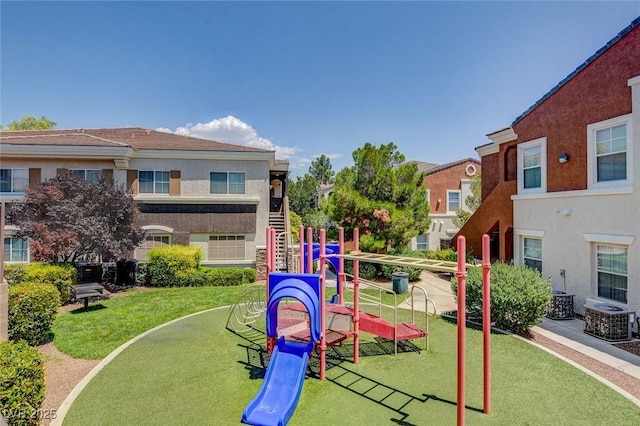 9303 Gilcrease Ave Unit 2217, Las Vegas, NV 89149 - communal playground featuring a lawn and central air condition unit