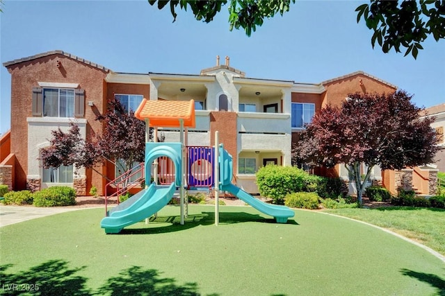 9303 Gilcrease Ave Unit 2217, Las Vegas, NV 89149 - communal playground featuring a lawn