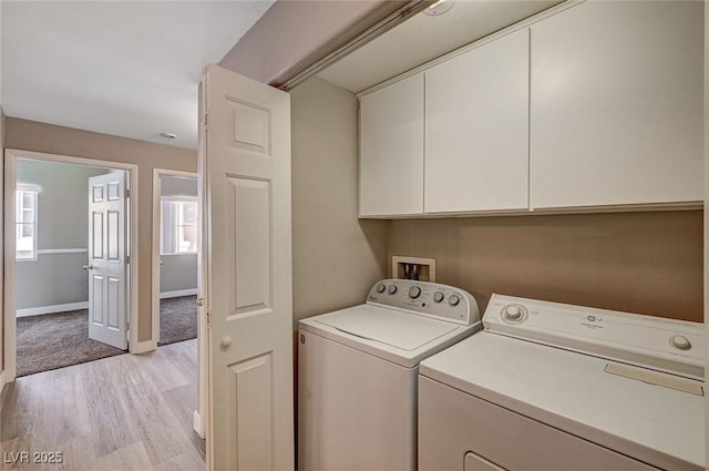 9303 Gilcrease Ave Unit 2217, Las Vegas, NV 89149 - washroom with cabinet space, separate washer and dryer, light wood-type flooring, and baseboards
