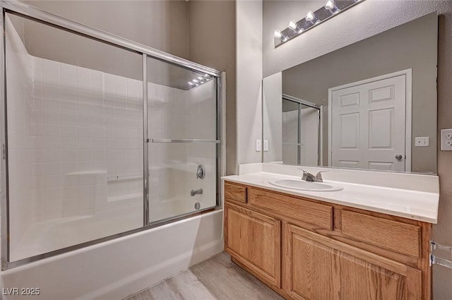 9303 Gilcrease Ave Unit 2217, Las Vegas, NV 89149 - full bath with vanity, wood finished floors, and combined bath / shower with glass door
