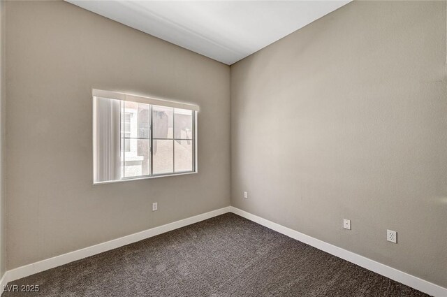 9303 Gilcrease Ave Unit 2217, Las Vegas, NV 89149 - unfurnished room featuring dark carpet and baseboards