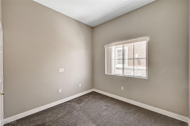 9303 Gilcrease Ave Unit 2217, Las Vegas, NV 89149 - unfurnished room featuring dark colored carpet and baseboards