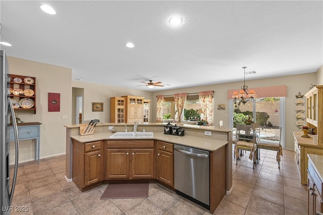 2467 Moonlight Valley Ave, Henderson, NV 89044 - kitchen featuring dishwasher, a sink, light countertops, healthy amount of natural light, and recessed lighting