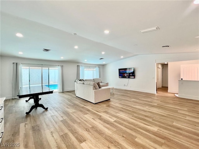6191 Bullion Blvd, Las Vegas, NV 89103 - living area featuring light wood-type flooring, vaulted ceiling, baseboards, and recessed lighting