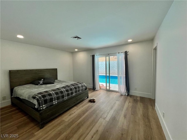 6191 Bullion Blvd, Las Vegas, NV 89103 - bedroom with access to exterior, wood finished floors, baseboards, and recessed lighting