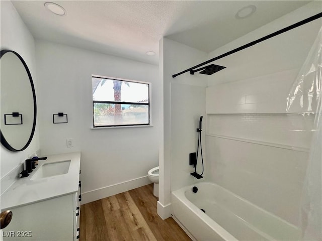 6191 Bullion Blvd, Las Vegas, NV 89103 - bathroom featuring toilet, vanity, shower / bath combination, wood finished floors, and baseboards