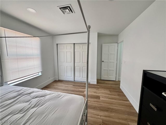 6191 Bullion Blvd, Las Vegas, NV 89103 - bedroom featuring a closet, wood finished floors, baseboards, and recessed lighting