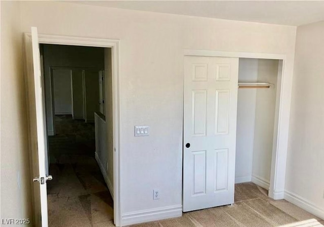 224 Wicked Wedge Way, Las Vegas, NV 89148 - unfurnished bedroom featuring a closet, baseboards, and light carpet