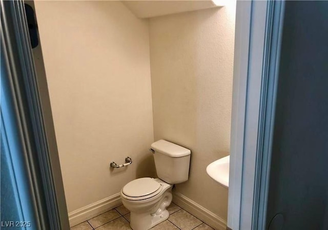 224 Wicked Wedge Way, Las Vegas, NV 89148 - bathroom with tile patterned floors, toilet, and baseboards