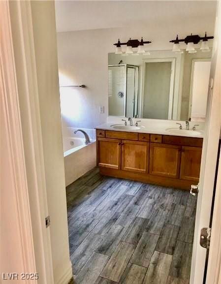 224 Wicked Wedge Way, Las Vegas, NV 89148 - full bathroom with a shower stall, a bath, double vanity, and wood finished floors