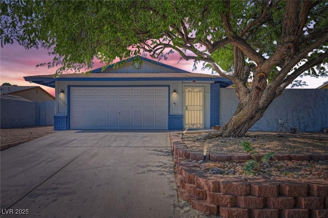 6309 Miraloma St, Las Vegas, NV 89108 - ranch-style house with driveway, a garage, and brick siding