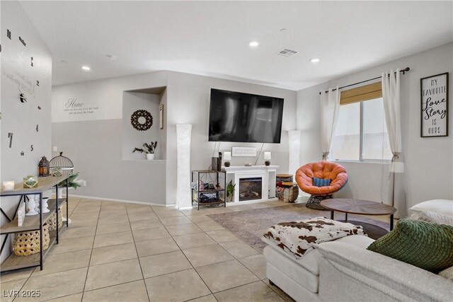 2169 Rio Rancho Pointe Pl, Henderson, NV 89002 - living area with tile patterned floors, recessed lighting, a glass covered fireplace, and baseboards