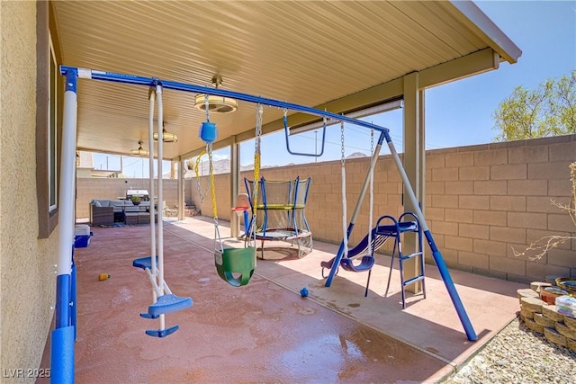2169 Rio Rancho Pointe Pl, Henderson, NV 89002 - view of playground with a trampoline, a fenced backyard, and a patio area