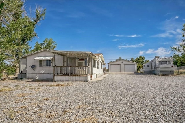 960 Third St, Pahrump, NV 89048 - manufactured / mobile home featuring a detached garage, an outbuilding, and covered porch