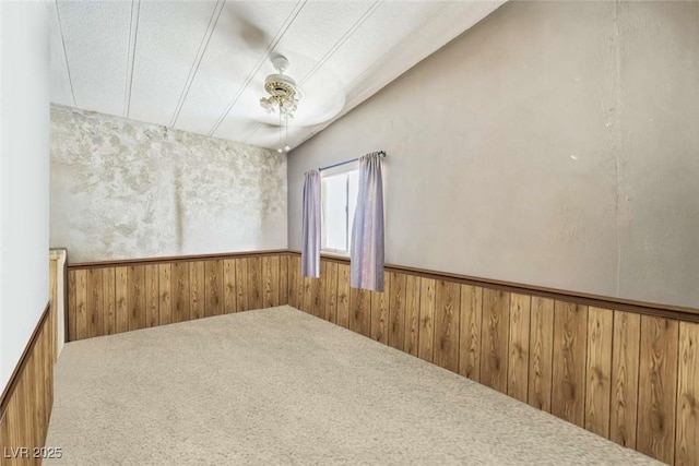 960 Third St, Pahrump, NV 89048 - carpeted empty room featuring wooden walls and a wainscoted wall