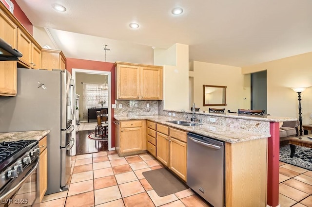 8777 Shady Peak Way, Las Vegas, NV 89123 - kitchen featuring appliances with stainless steel finishes, a sink, a peninsula, a breakfast bar, and decorative backsplash