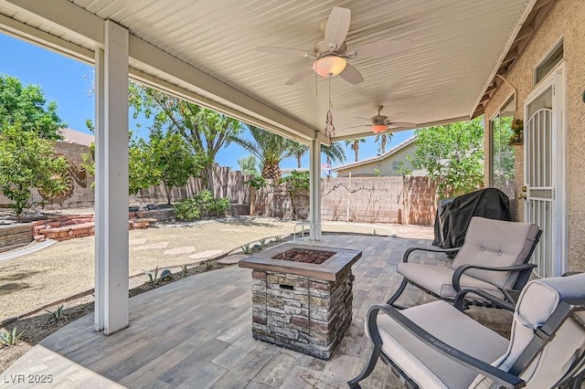 8777 Shady Peak Way, Las Vegas, NV 89123 - fenced backyard featuring an outdoor fire pit, a patio area, a ceiling fan, and a grill