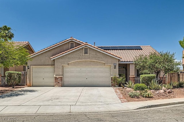 8777 Shady Peak Way, Las Vegas, NV 89123 - view of front of property featuring a tiled roof, a garage, stucco siding, and driveway