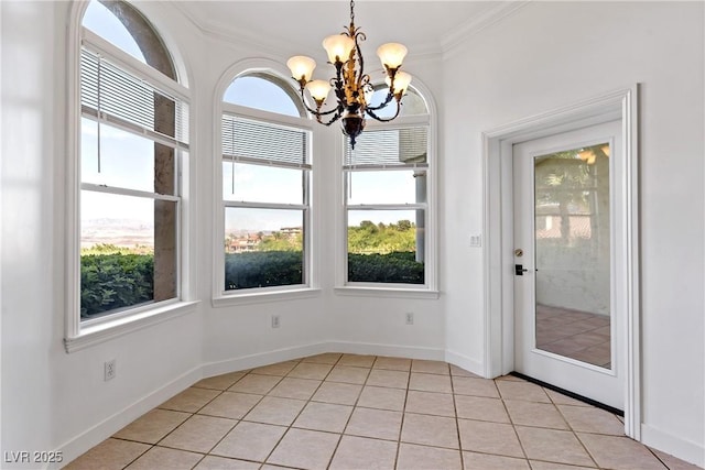 12 Strada Di Circolo -, Unit Henderson, NV 89011 - unfurnished dining area with a chandelier, plenty of natural light, crown molding, light tile patterned flooring, and baseboards