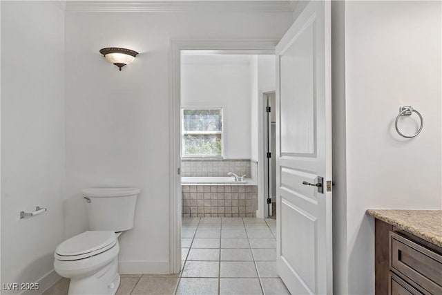 12 Strada Di Circolo -, Unit Henderson, NV 89011 - full bathroom with toilet, a garden tub, vanity, tile patterned floors, and ornamental molding