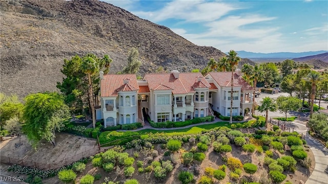 12 Strada Di Circolo -, Unit Henderson, NV 89011 - view of front of home featuring a balcony, a mountain view, a tiled roof, and stucco siding