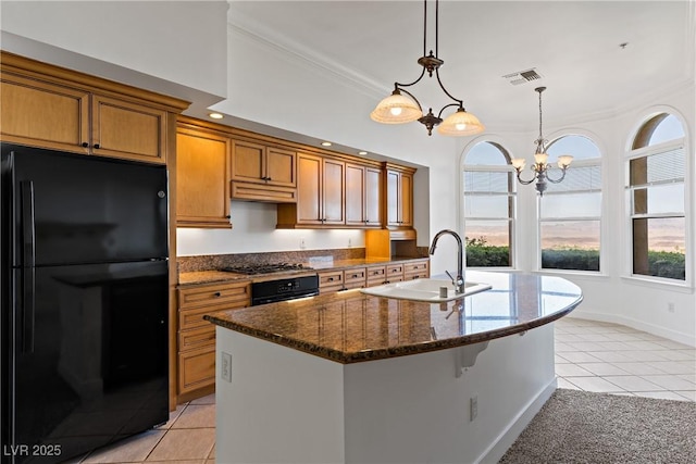 12 Strada Di Circolo -, Unit Henderson, NV 89011 - kitchen featuring freestanding refrigerator, a sink, light tile patterned flooring, wall oven, and brown cabinets