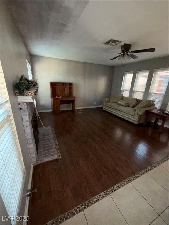 6521 Sugarpine Ln, Las Vegas, NV 89107 - living room featuring ceiling fan, wood finished floors, and a brick fireplace
