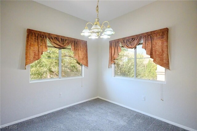 8501 W University Ave Unit 2020, Las Vegas, NV 89147 - spare room with a chandelier, carpet flooring, and baseboards