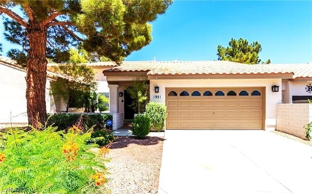 1951 Moyer Dr, Henderson, NV 89074 - view of front of house with an attached garage, driveway, stucco siding, and a tile roof