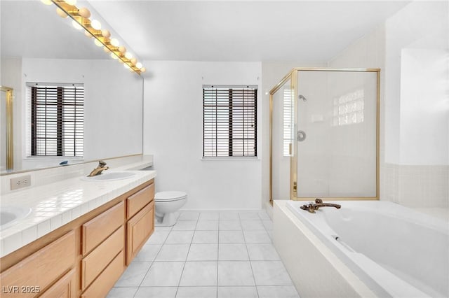 1951 Moyer Dr, Henderson, NV 89074 - full bath with a stall shower, a bath, double vanity, tile patterned flooring, and toilet