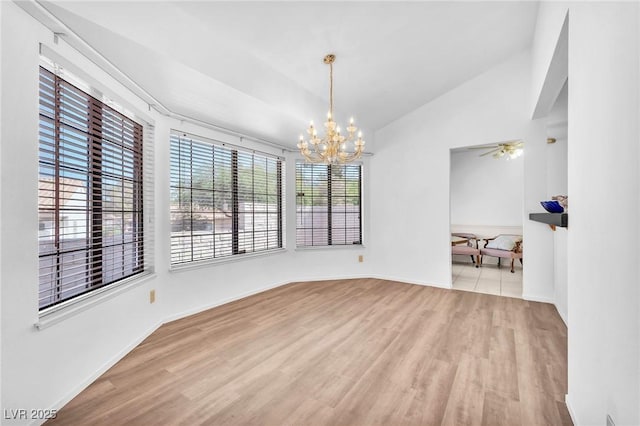 1951 Moyer Dr, Henderson, NV 89074 - empty room featuring wood finished floors, vaulted ceiling, a chandelier, and baseboards