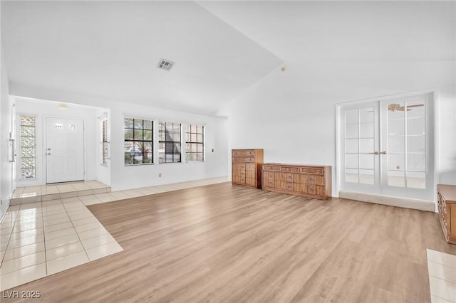 1951 Moyer Dr, Henderson, NV 89074 - unfurnished living room with high vaulted ceiling and light wood-style floors