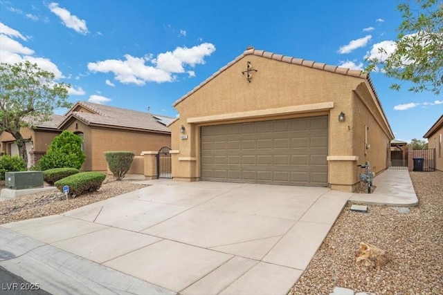 4062 Vulcan St, Las Vegas, NV 89122 - view of front facade with a gate, stucco siding, an attached garage, and driveway