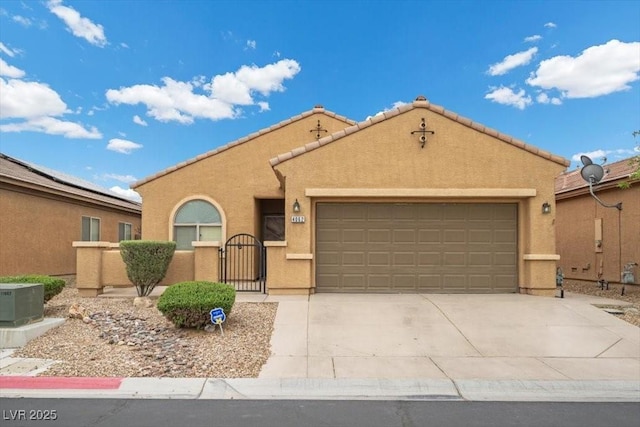 4062 Vulcan St, Las Vegas, NV 89122 - mediterranean / spanish-style house featuring an attached garage, stucco siding, concrete driveway, a gate, and a tile roof