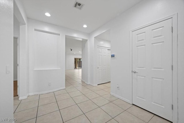 4062 Vulcan St, Las Vegas, NV 89122 - hall featuring light tile patterned floors and recessed lighting