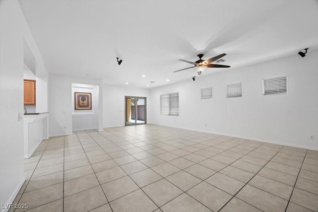 4062 Vulcan St, Las Vegas, NV 89122 - unfurnished living room with a ceiling fan, light tile patterned flooring, and recessed lighting