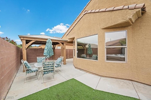 4062 Vulcan St, Las Vegas, NV 89122 - fenced backyard featuring a gazebo and a patio area