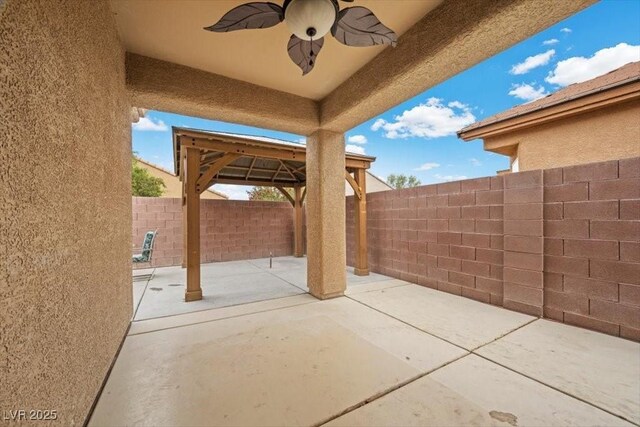 4062 Vulcan St, Las Vegas, NV 89122 - fenced backyard with a patio, ceiling fan, and a gazebo