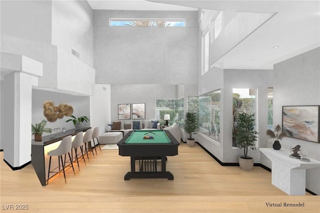 60 Innisbrook Ave, Las Vegas, NV 89113 - playroom featuring a towering ceiling, pool table, wood finished floors, and healthy amount of natural light